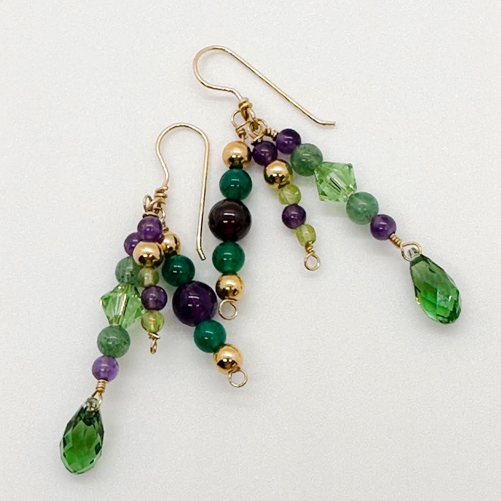 Handmade Earrings made with
amethyst, Swarovski crystals, peridot & goldfill